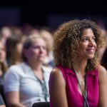 front-view-mixedrace-businesswoman-speaking-animatedly-diverse-crowd-business-people-with